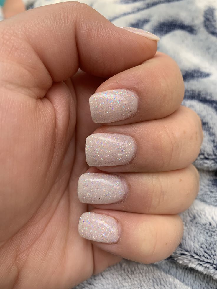 Elegant Sparkling Pastel Nails with Whimsical Glitter and Modern Squared Shape.