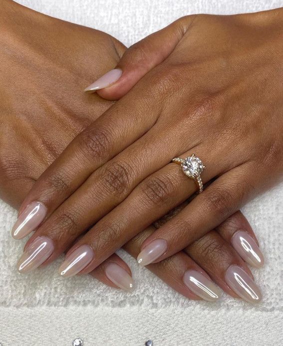 Chic Almond-Shaped Nails with Polished Nude Finish for Any Occasion.