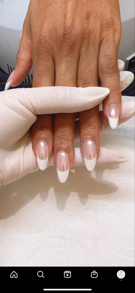 Elegant French Tip Almond Nails: A Chic Blend of Soft Pink and Crisp White for Any Occasion.