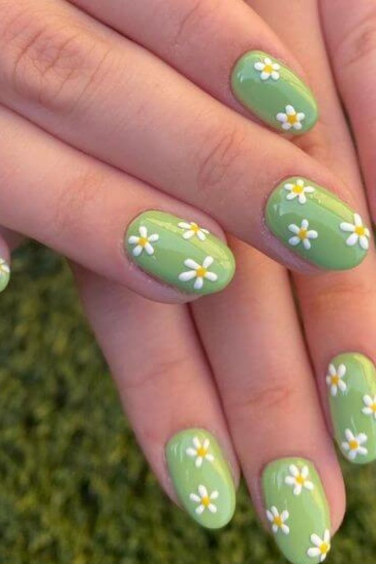 Delicate Daisy-Adorned Fresh Green Nail Design for a Playful, Nature-Inspired Look.