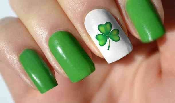 Chic St. Patrick's Day Nail Design: Vibrant Green with Playful Shamrock Accents.