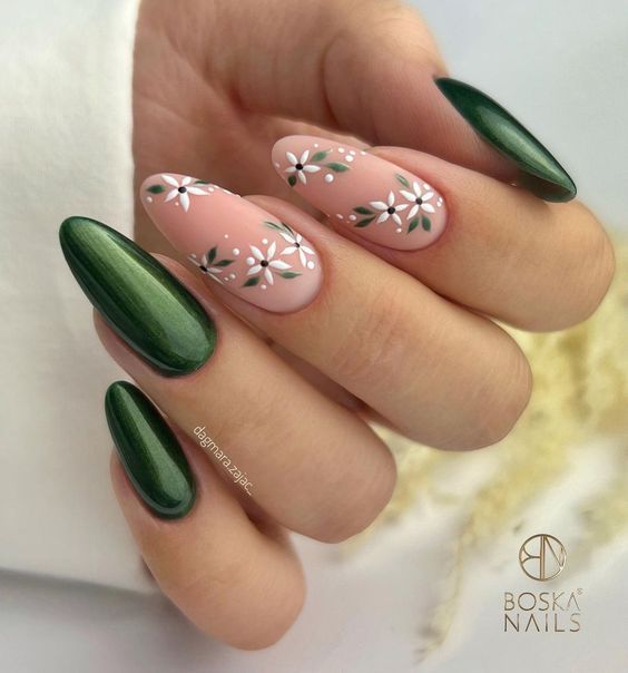 Sophisticated Deep Green and Soft Pink Nail Design with Delicate Floral Accents.