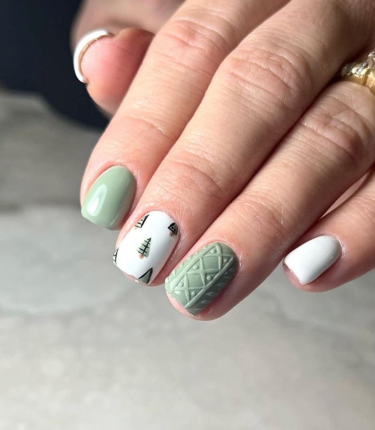 Chic Nail Design: Muted Green and White with Textured Geometric and Forest Motifs.