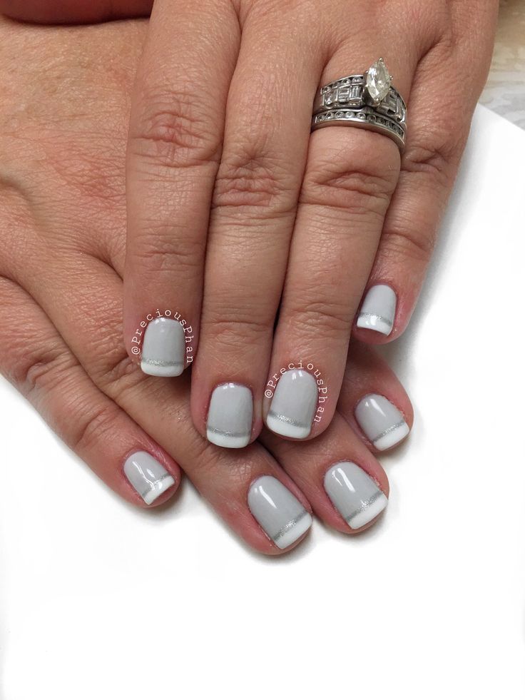 Chic and Sophisticated Gray Nail Design with Modern French Tips and Delicate White Accents