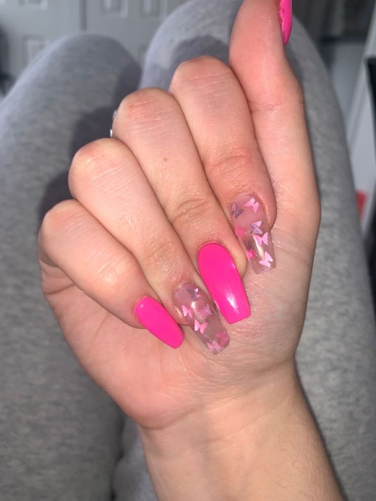 Bold and Playful Bright Pink Nail Design with Clear Accents and Pastel Star Motifs