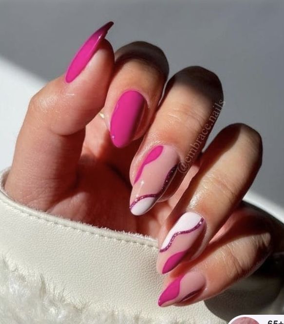 Vibrant Pink and Soft White Nail Design with Modern Wave Pattern and Elegant Embellishments.