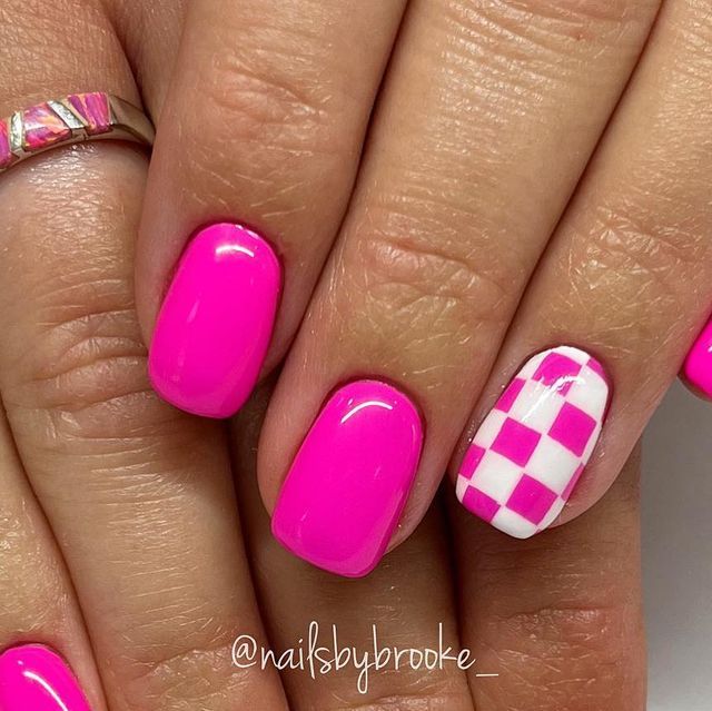 Chic Checkerboard Pink Nails: A Bold Manicure Statement.