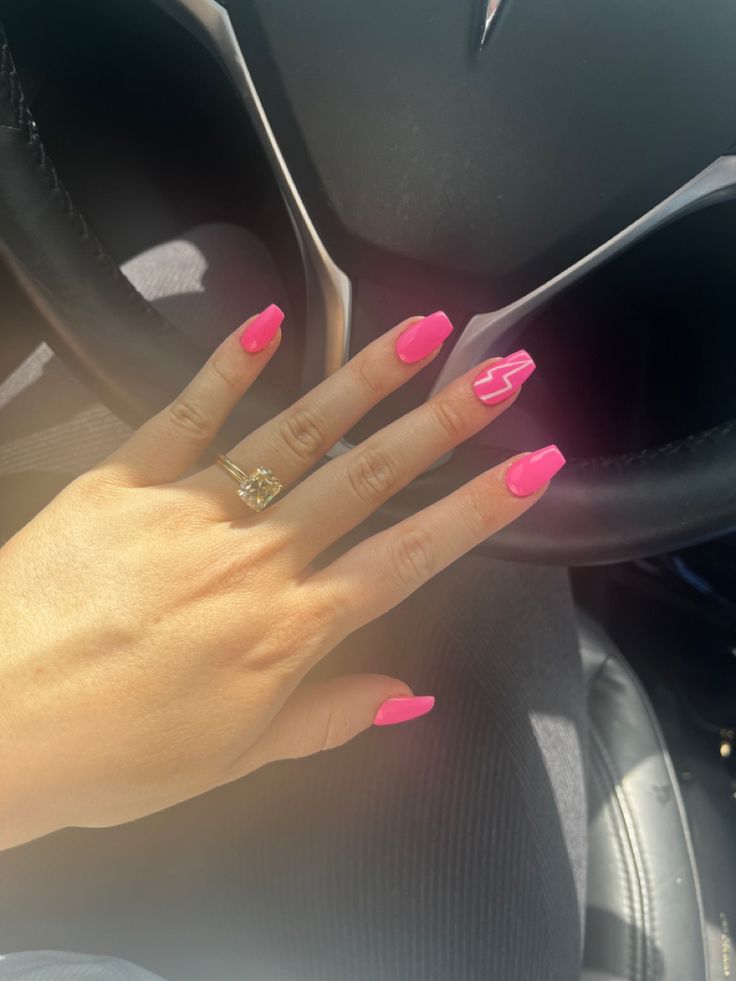 Bold Vibrant Pink Nail Design with Playful Zigzag Accent on Long Nails.