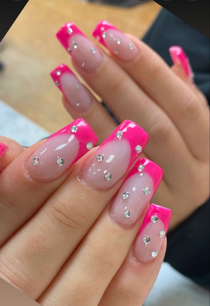 Glamorous Elegant Nail Design with Glossy Finish and Pink French Tips Adorned with Rhinestones.