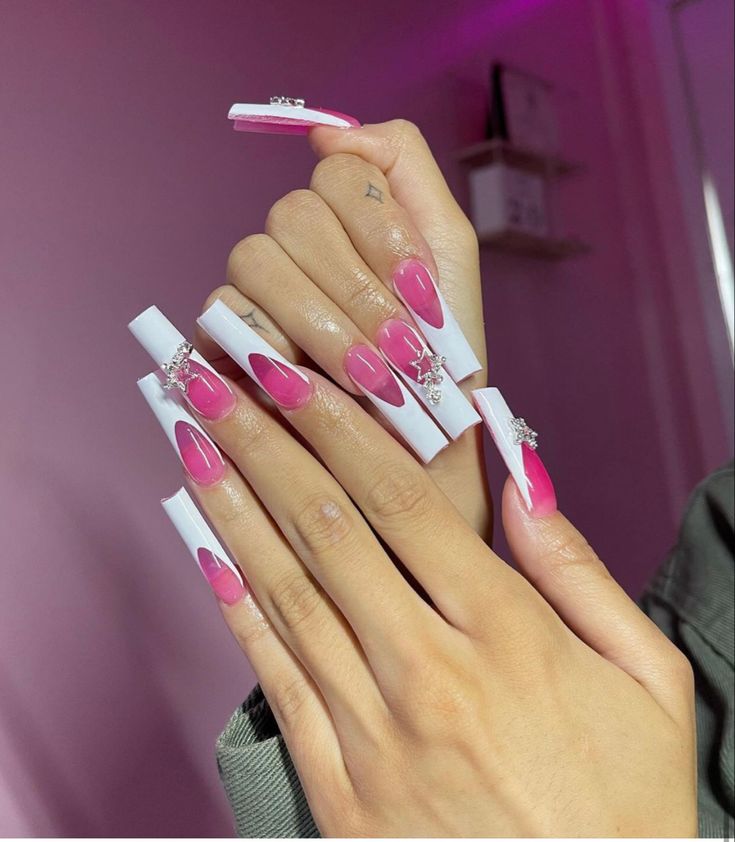 Chic Heart-Adorned Gradient Pink and Glossy White Nail Design with Rhinestone Accents.