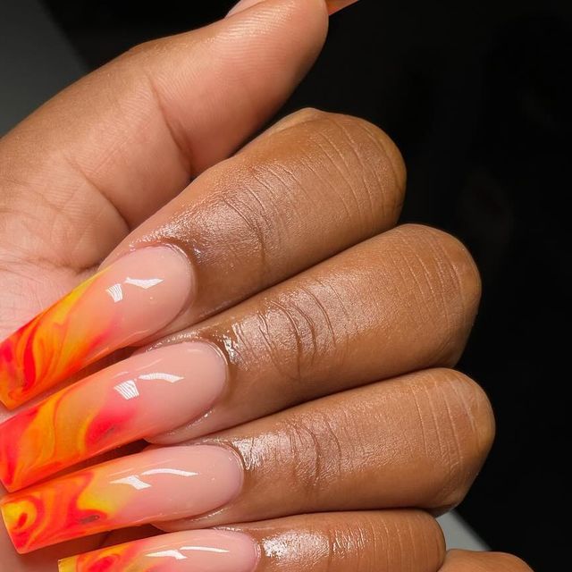 Bold Gradient Nail Design with Striking Orange and Yellow Hues for a Statement Manicure.