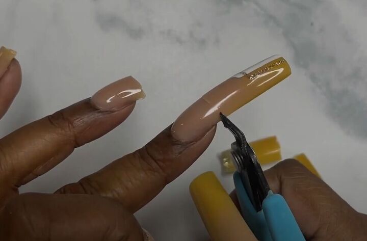 Stylish Nude and Mustard Yellow Nail Design: A Blend of Modern Elegance and Creative Precision.