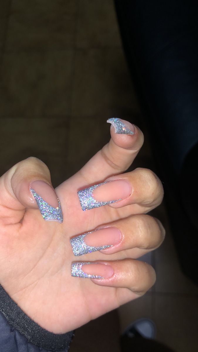 Modern Glittery Nail Design with Holographic Sparkle and Angular Tips.