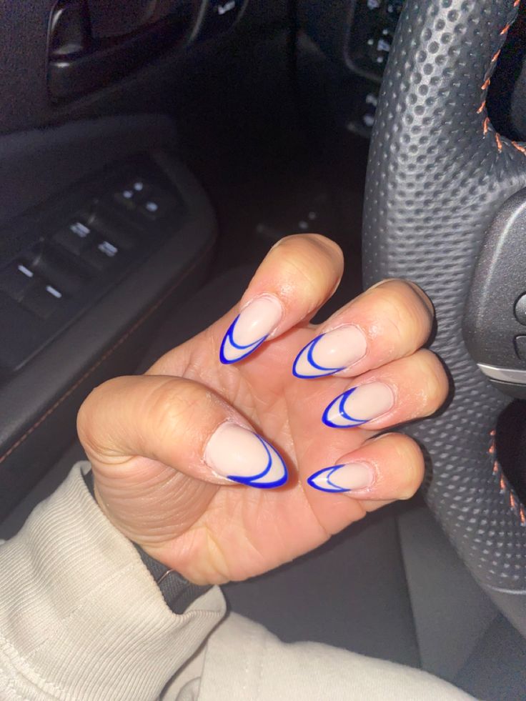 Chic French Tip Nail Design with Nude Base and Vibrant Blue Edges