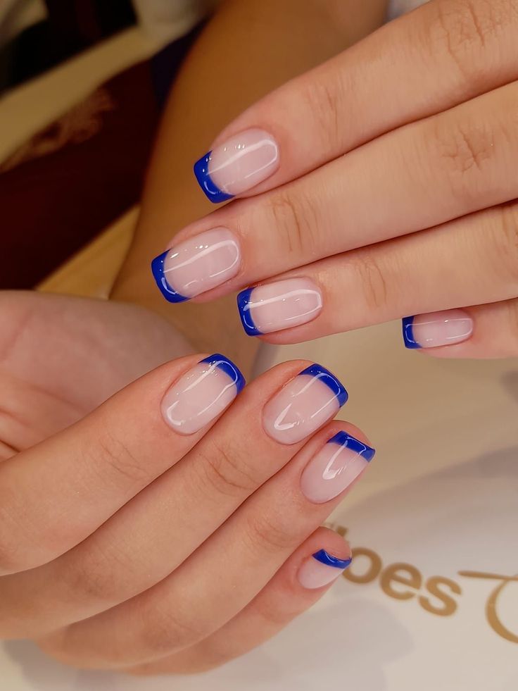 Chic Modern French Manicure with Bold Blue Tips