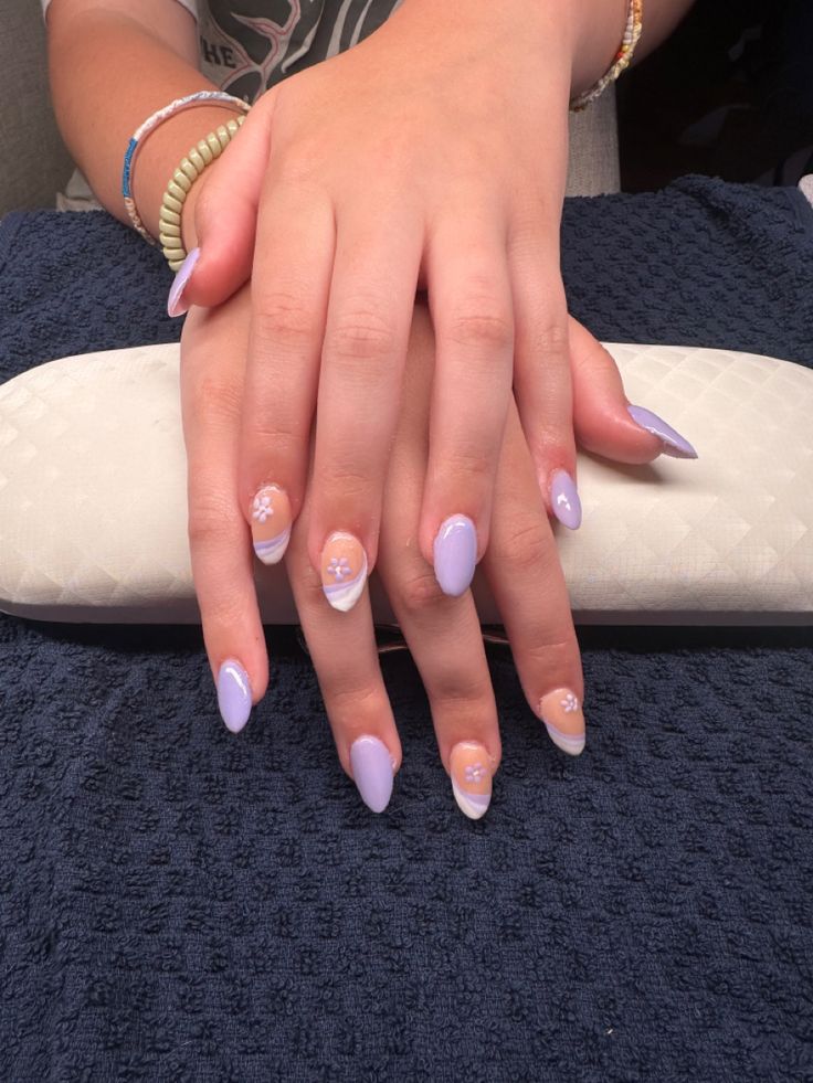 Sophisticated Lavender Nail Design with French Tips and Floral Accents