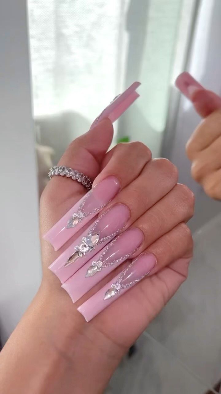 Sophisticated Long Pink Nail Art with Floral Accents and Silver Detailing