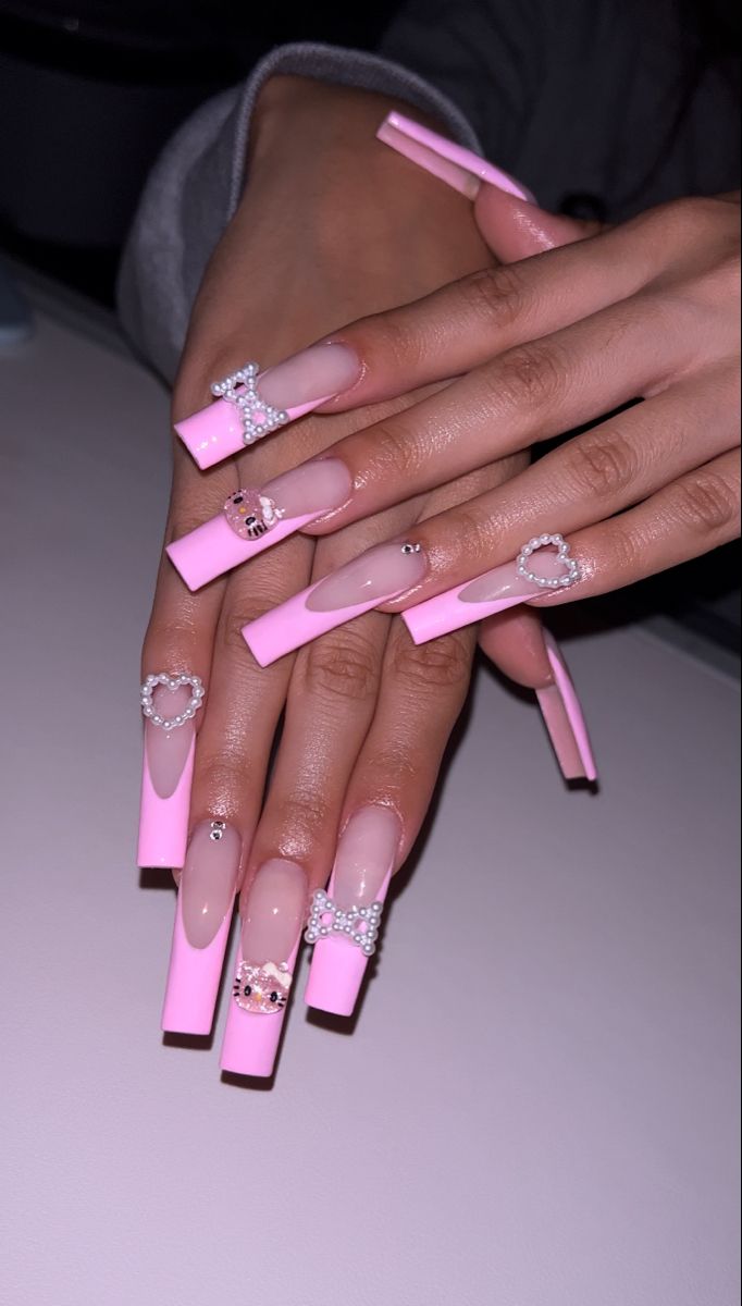 Playful Pink and Clear Long Square Nail Design with Glamorous Jewels and Pearls.