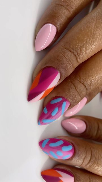 Vibrant Geometric Nail Design: Playful Patterns in Pink and Blue