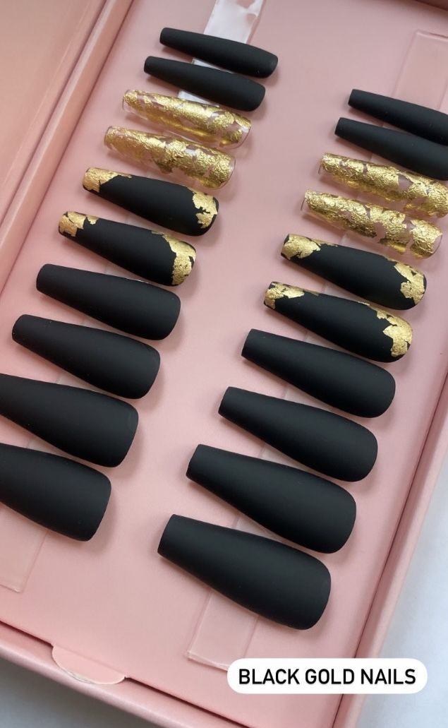 Chic Matte Black and Gold Nail Design with Sophisticated Long Shapes