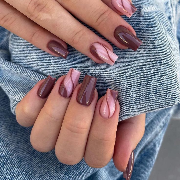 Elegant Nail Design with Rich Browns, Soft Pinks, and Intricate Swirls