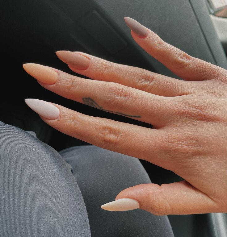 Chic Almond-Shaped Nails with Matte Ombre Effect in Peach and Pink.