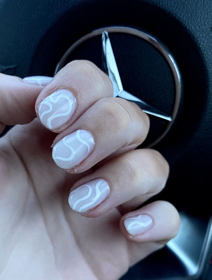 Elegant Minimalist Nail Design: Soft White Base with Flowing Wavy Lines