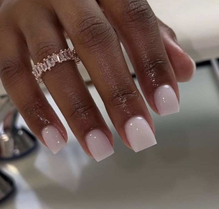 Sophisticated Pink Square Manicure with Elegant Ring Accents.