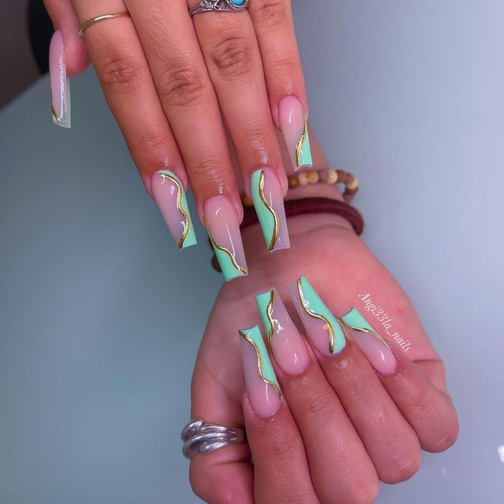 Elegant Modern Nail Design: Soft Pink and Mint Green with Wavy Lines and Glossy Finish.