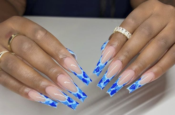 Chic Almond-Shaped Nails: Striking Blue and White Pattern with Nude Base