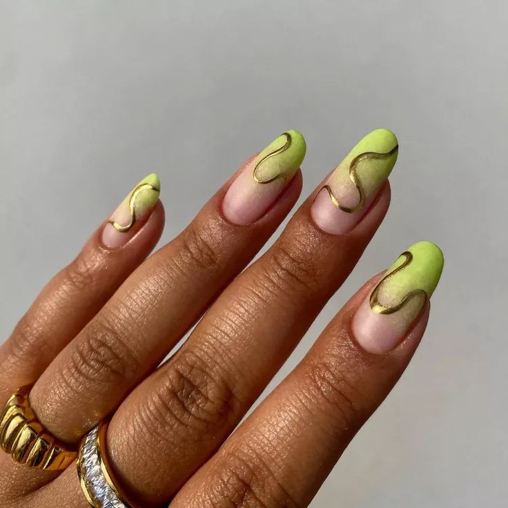 Chic Vibrant Nail Design: Soft Green and Nude with Glossy Finishes and Gold Accents