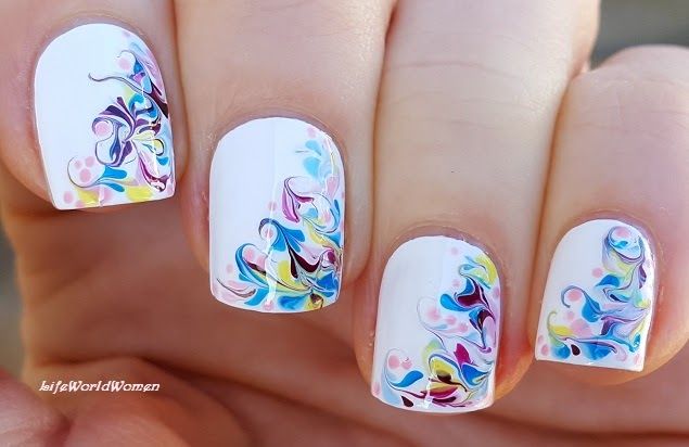 Vibrant Floral Nail Art Design: Playful Elegance on White Background.