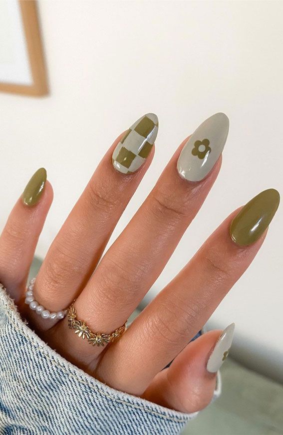 Chic Olive Green and Beige Nail Design with Playful Patterns and Natural Aesthetic.