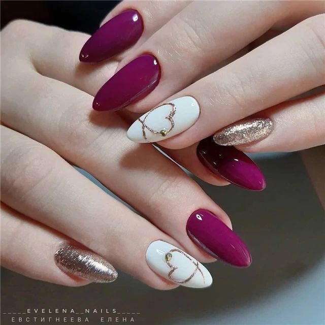 Chic Elegant Nail Design: Deep Burgundy with White Heart Accents and Gold Detailing.