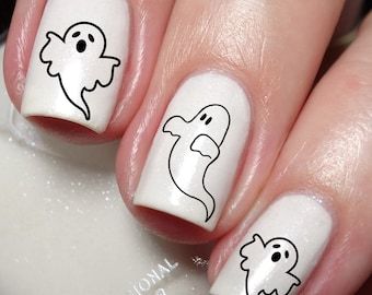 Playful Ghost Nail Art: Adorable Outlines on Sparkling White for Festive Fun