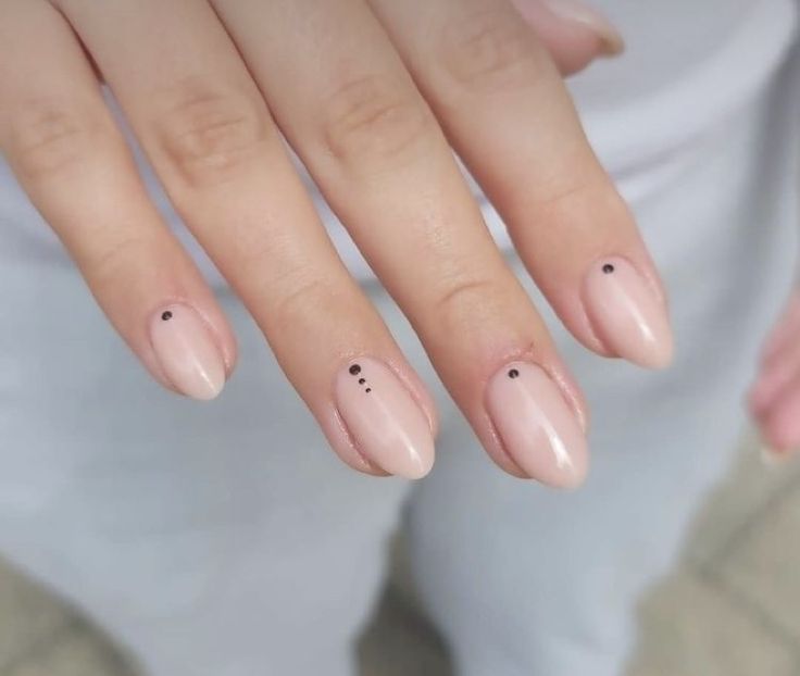 Chic Minimalist Nude Nails with Modern Black Dot Accents