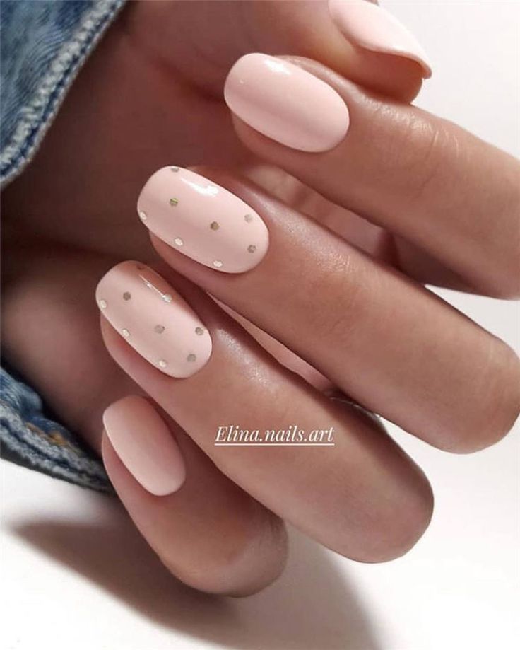 Sophisticated Elegant Nude Nail Design with Glossy Finishes and Delicate Silver Accents.