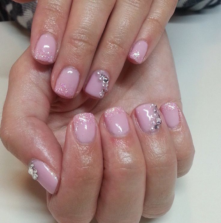 Elegant Pink Gradient Nail Design with Rhinestone Accents for Versatile Occasions.