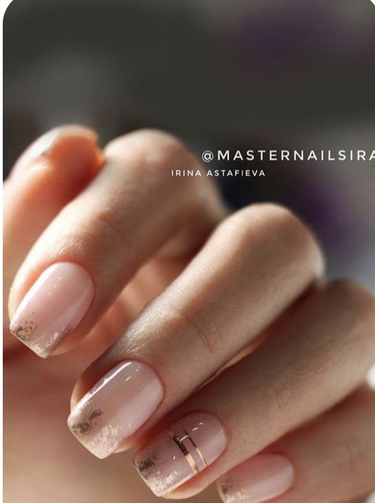 Sophisticated Nude Nail Design with Gold Glitter Ombre and Minimalist Accent.