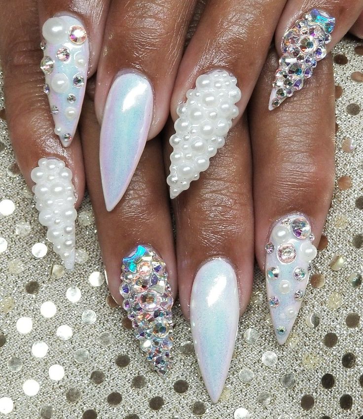 Luxurious Iridescent Nail Design with Pearl Accents and Pointed Sophistication