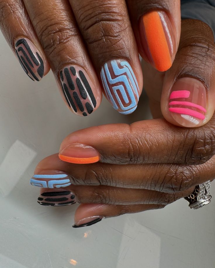 Geometric Colorful Nail Art: A Dynamic Blend of Vibrant Hues and Finishes.