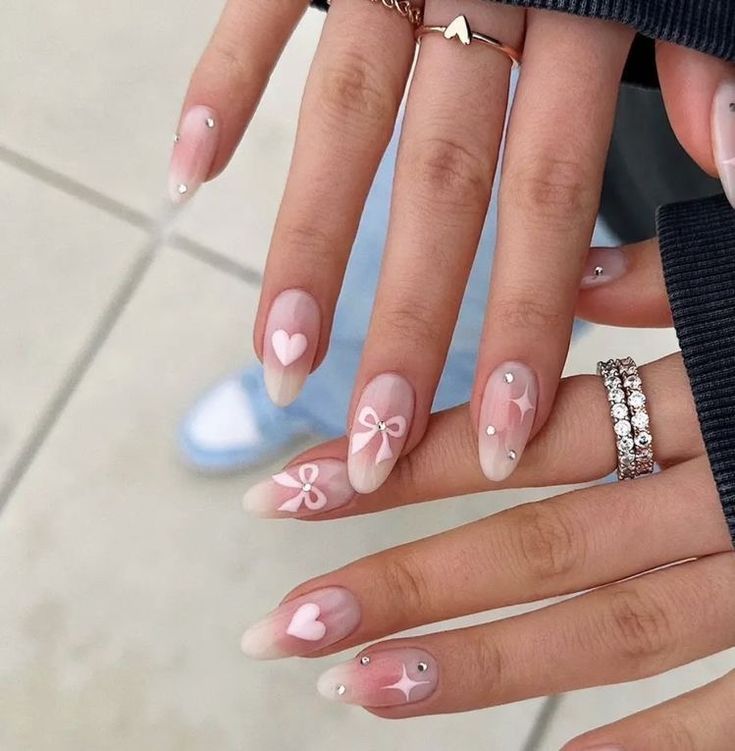 Charming Pastel Ombre Nail Design with Whimsical Decorations for a Romantic Vibe.