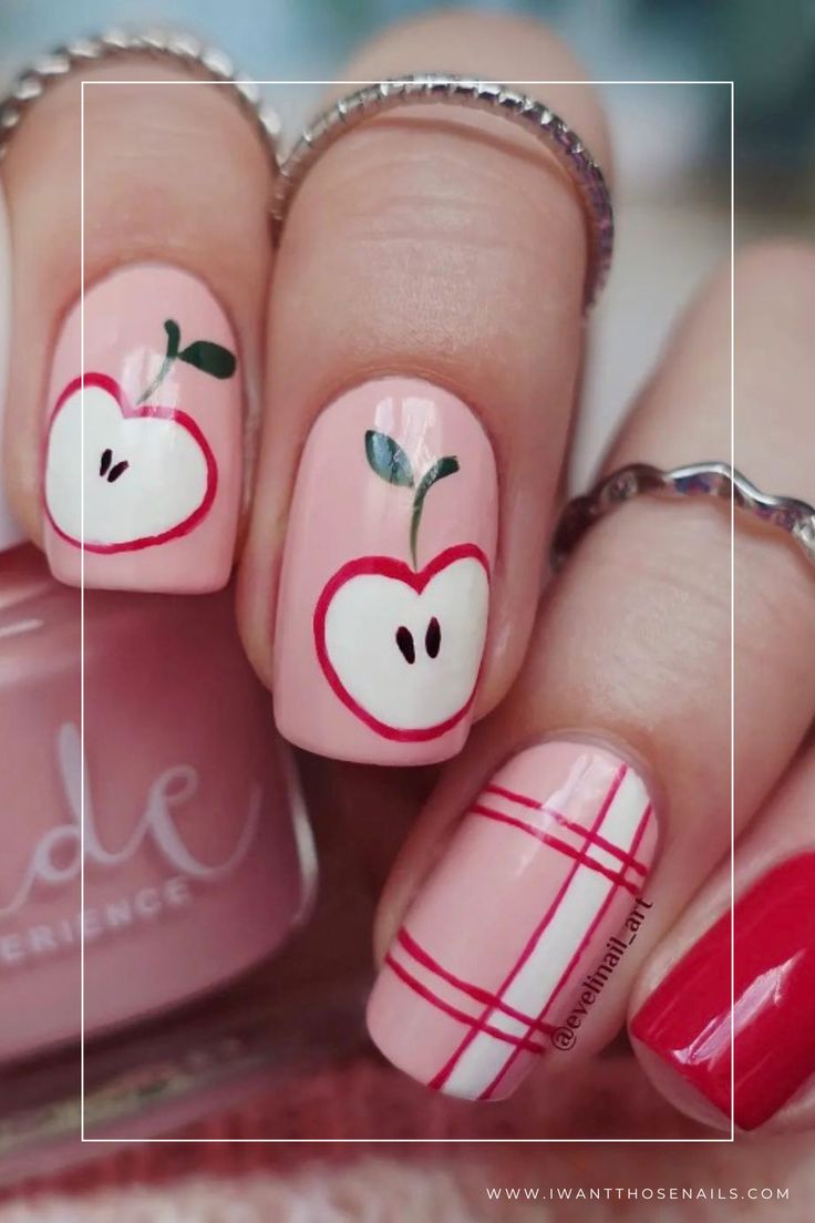 Charming Apple-Themed Nail Design with Vibrant Colors and Whimsical Patterns