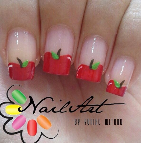 Vibrant Fruit-Inspired Nail Art with Glossy Apple Motifs and Whimsical Accents.