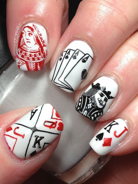 Playful Poker-Inspired Nail Design with Iconic Card Motifs in Red, White, and Black.