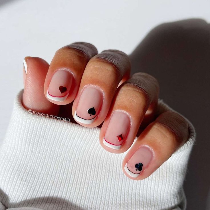 Chic Minimalist French Tip Nails with Playful Heart Accents