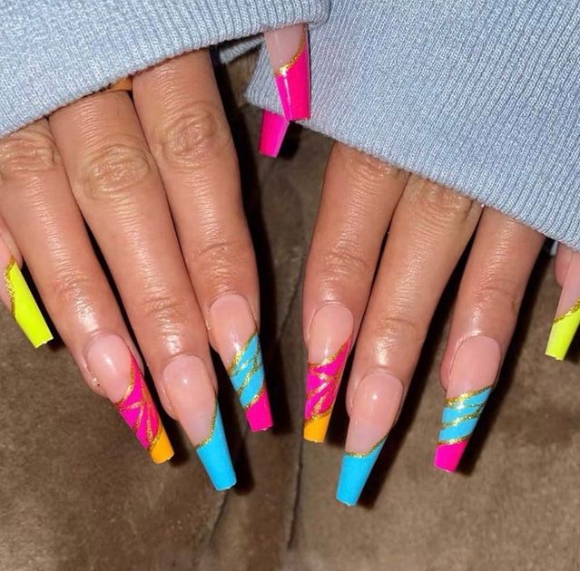 Bold and Playful Vibrant Nail Design with Geometric Patterns and Bright Colors.