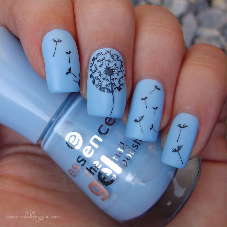 Whimsical Dandelion-Inspired Nail Design with Light Blue Base and Artistic Black Accents