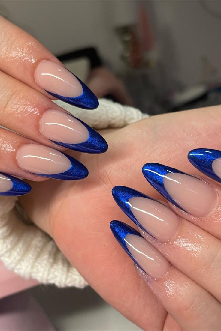 Chic Almond-Shaped Long Nails with Glossy Nude Base and Striking Royal Blue Tips.