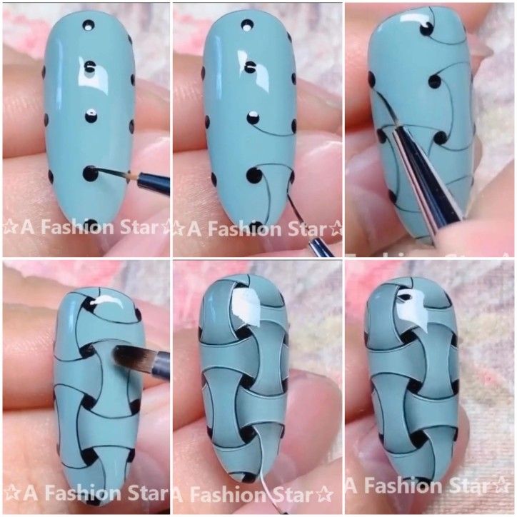 Elegant Pastel Blue Nail Art with Bold Black Accents and Playful Patterns